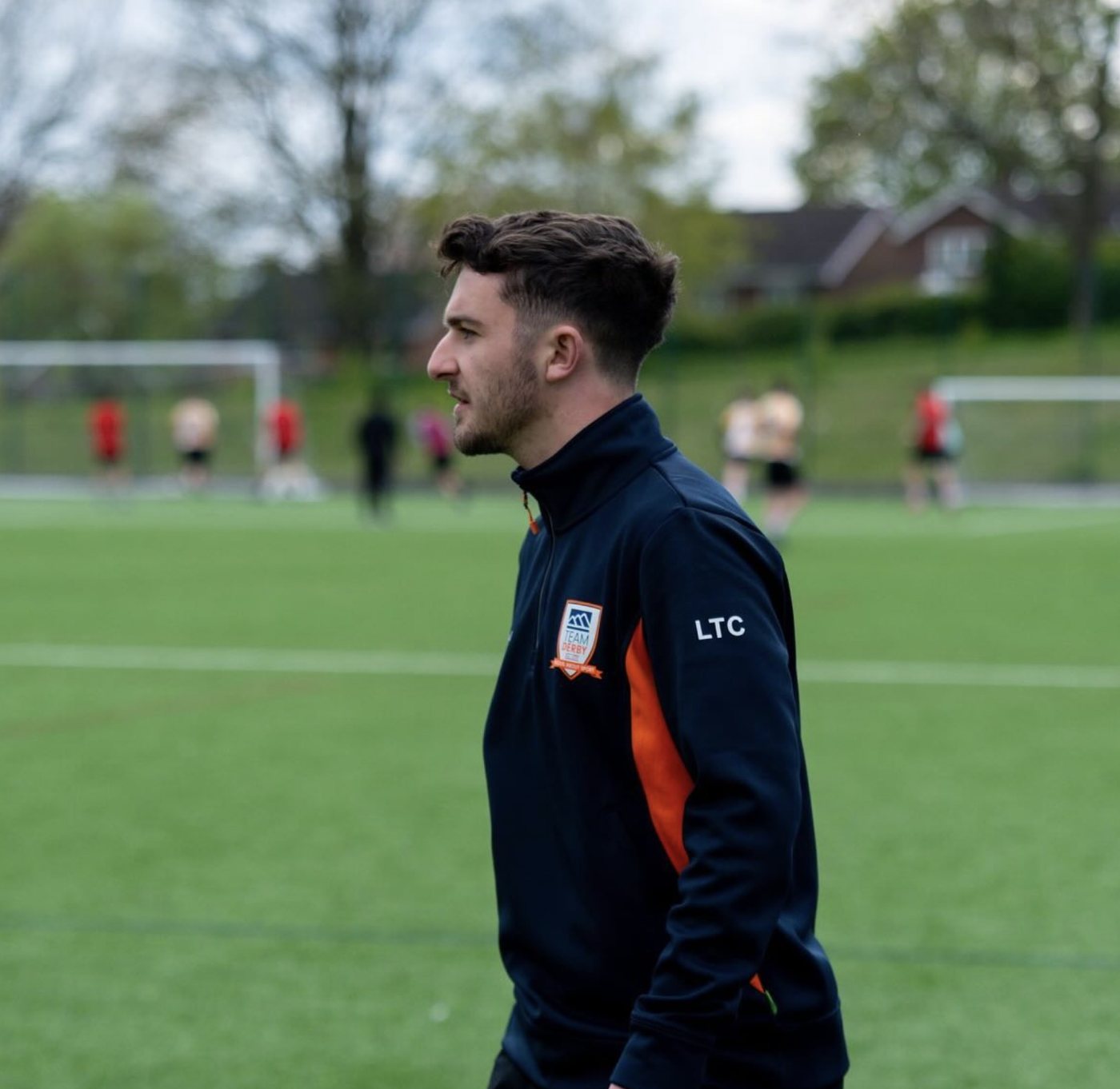 Coach Liam Chawke on the touchline in LTC training kit