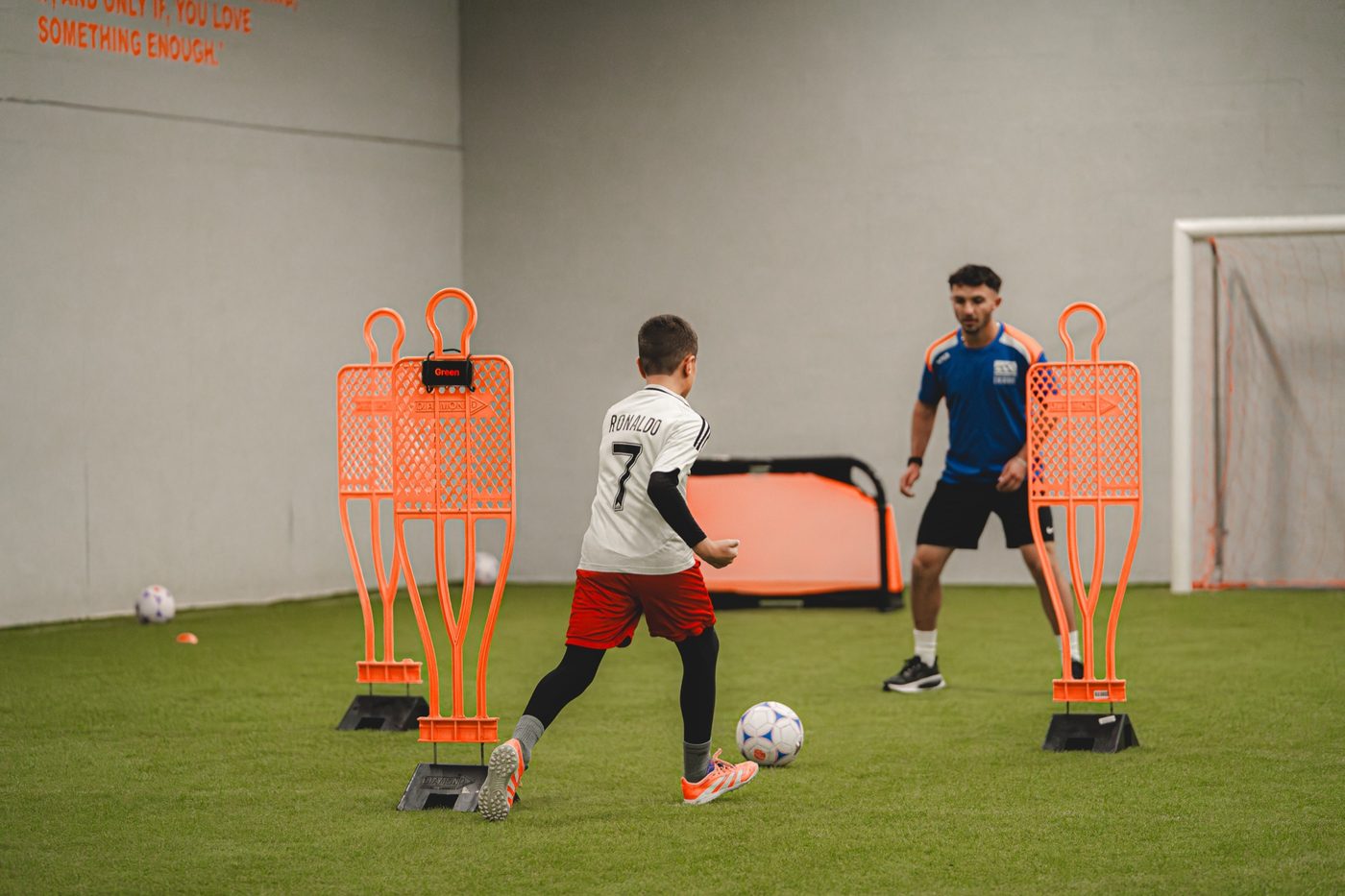 Finishing reps against mannequins at indoor training